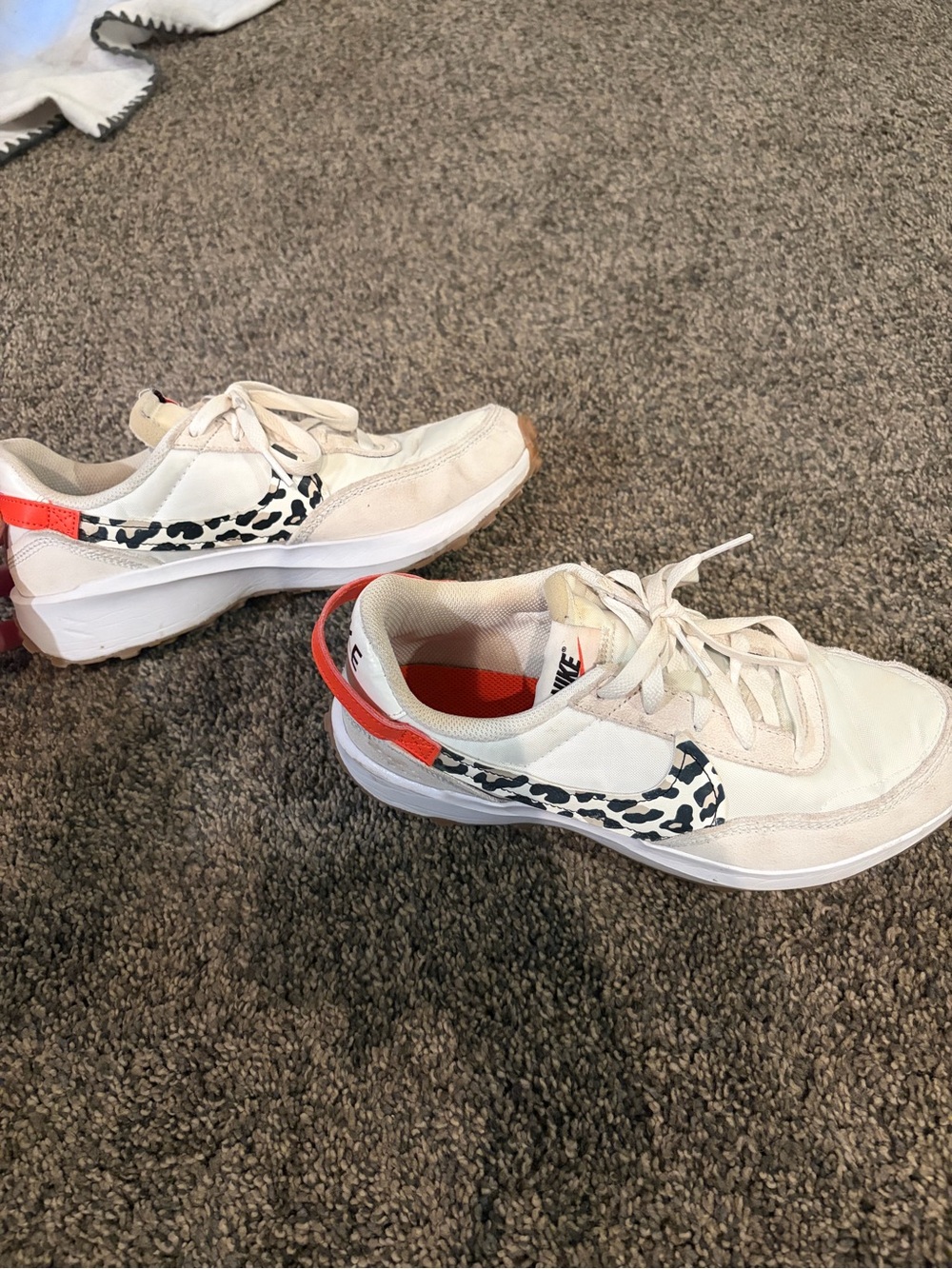 Nike Women’s White Sneakers with Black Animal-Print Swoosh and Coral Accent